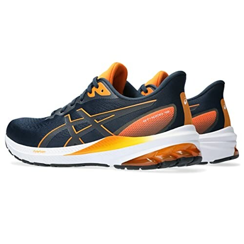 Asics Gel Nimbus running shoes in navy and orange.