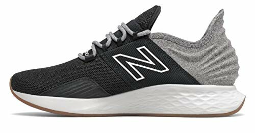Black and gray New Balance sneaker with white sole.