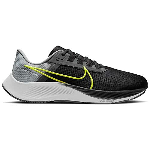 Black running shoe with yellow swoosh design