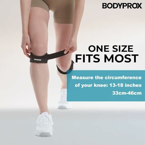 Person wearing Bodyprox knee support strap with size information.