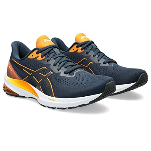 Navy and orange running shoes with a sleek design.