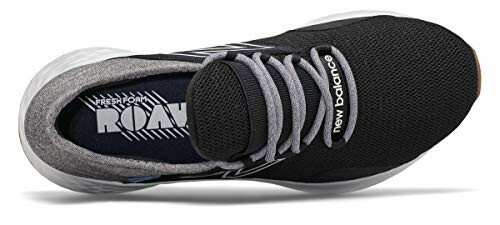 Top view of New Balance running shoe with black mesh and gray laces.