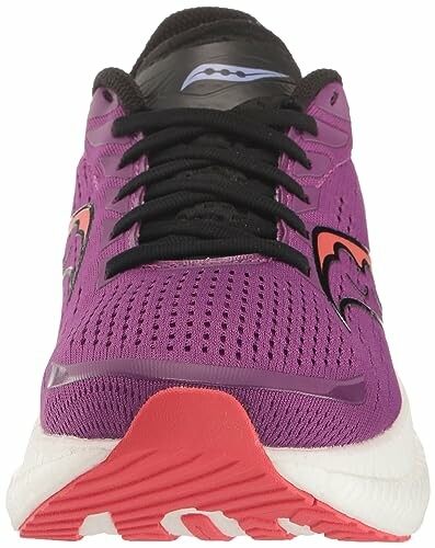 Front view of a purple running shoe with black laces and red sole.